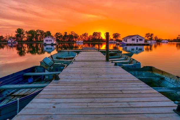 Autumn Sunset colored reflections at the boathouses at Horseshoe Pond at Presque Isle State Park