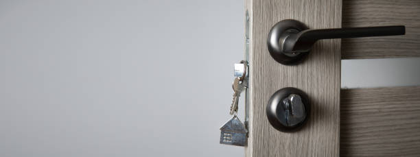 istock house key in a door 1350860603