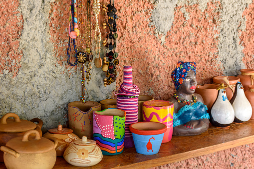 Colorful Moroccan cooking pots at a souk in Marrakech. A tajine is a Maroccan dish from that is named after the special earthenware pot in which it is cooked.