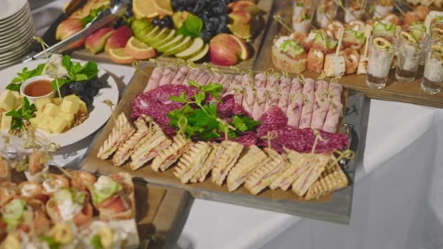 Snack trays on a large table. Buffet at a social event