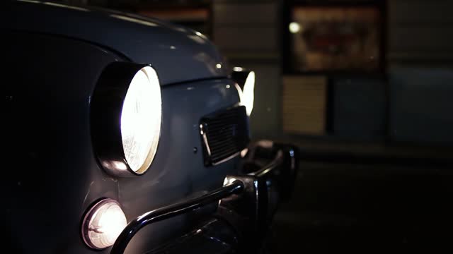 Old Car Parking in the Street at Night. 4K Resolution.