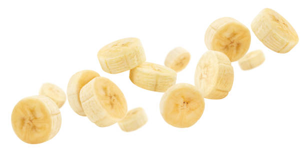 istock Flying banana slices on white 1350863389