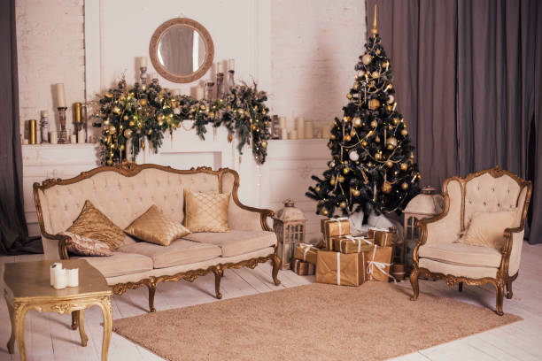 istock Christmas tree with presents underneath in living room 1350864437