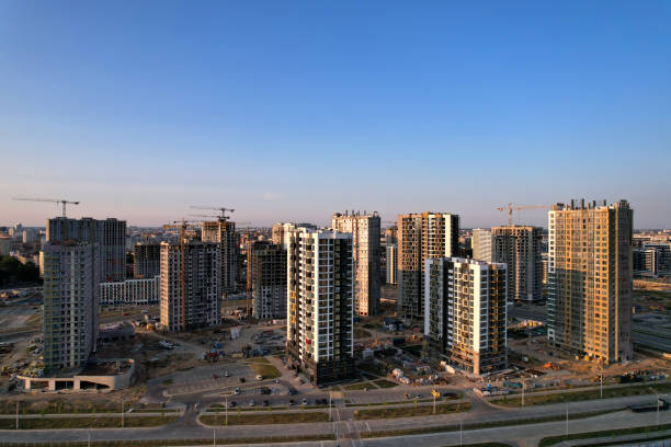 istock Construction site with tower cranes during conctruct the high-rise building. Cranes at the pouring concrete into the formwork. 1350865366