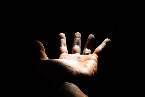 istock Close up hand photo, center background with low key technique 1350865530