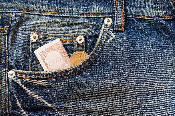 istock money in to a pocket 135086584