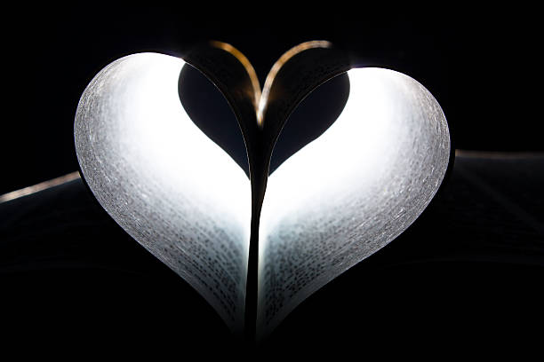 istock Heart shape formed in the leaves of a book 135086683