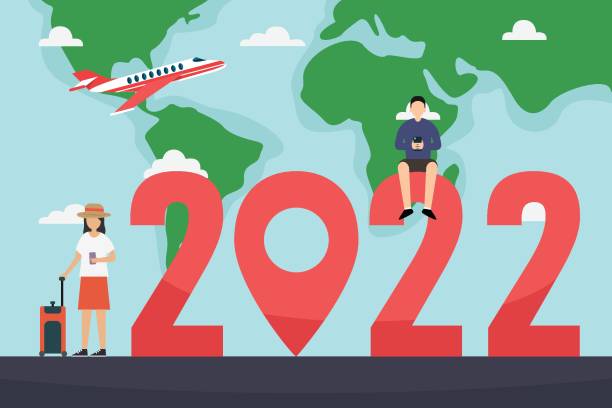 istock Two people travel around world with 2022 numbers 1350866856