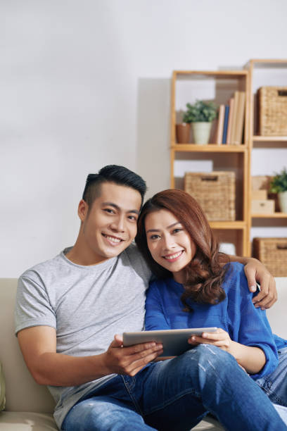 istock Asian Couple Embracing Together 1350869221