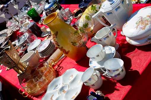 Nice, France - May 17, 2014: Old Porcelain Tableware for sale at the antique market, held on Saturdays, on the built late 18th century Garibaldi square, located at the outskirts of the Old Town