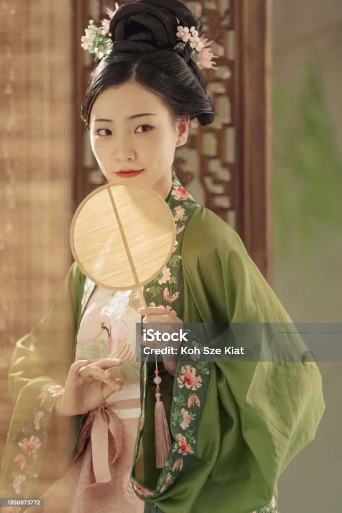 Beautiful Chinese woman in period costume hanfu photographed in a studio portrait setting Chinese Ethnicity Stock Photo