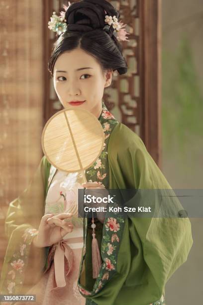 Beautiful Chinese Woman In Period Costume Hanfu Photographed In A Studio Portrait Setting Stock Photo - Download Image Now