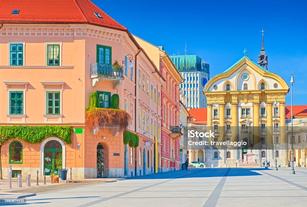 View of Congress Square and the Ursuline Church of the Holy Trinity in the center of Ljubljana, Slovenia View of Congress Square and the Ursuline Church of the Holy Trinity in the center of Ljubljana, Slovenia. Ljubljana Stock Photo