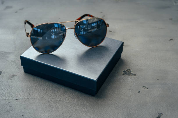 istock New dark aviator glasses on grey concrete background 1350880709