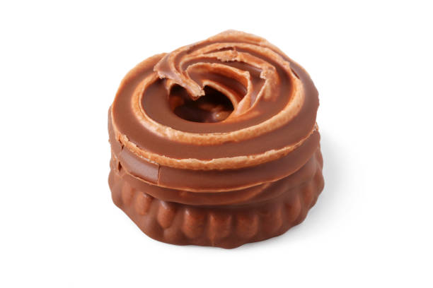 Brownie with cream filling in chocolate glaze isolated on white
