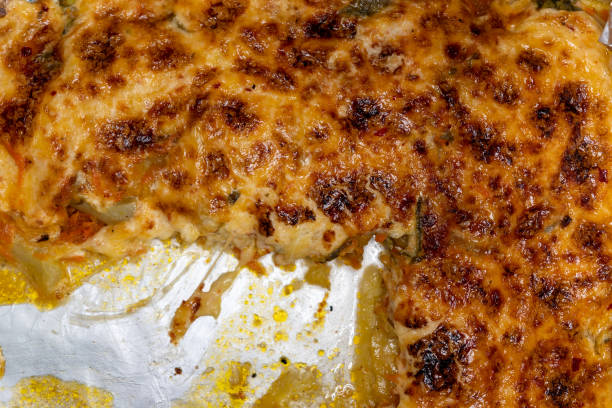 baked cheese crust in the oven on a baking sheet stock photo