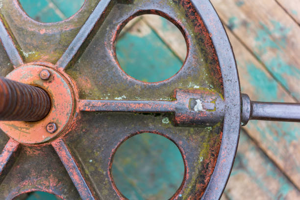 old metal round valve on wooden floor background stock photo