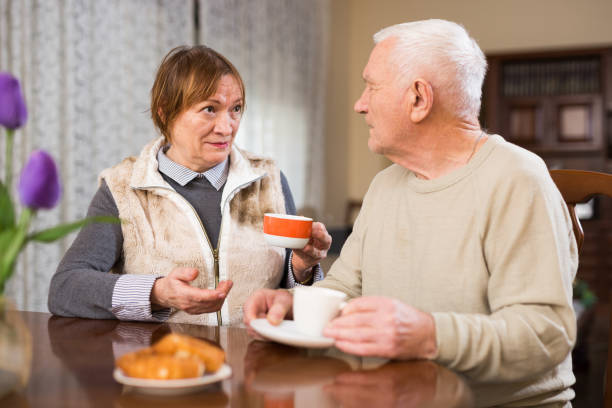 istock Senior couple drinking tea together 1350883853