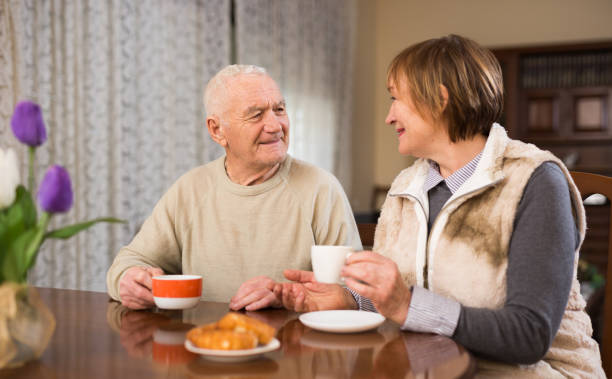 istock Elderly man and woman enjoying conversation 1350883854