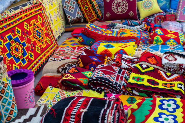 istock Fabrics, textiles and turkish rugs at a bazaar in Turkey 1350885444