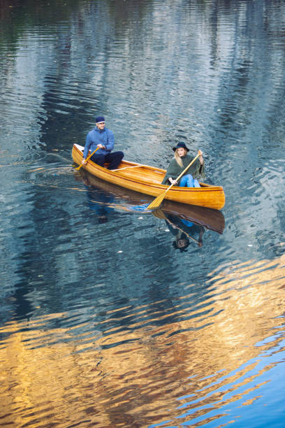 istock Couple enjoying wonderful day in canoe on river 1350885867