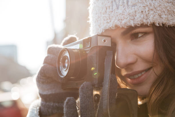 istock Young beautiful woman photographer 1350887553