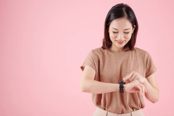 istock Woman Checking Information on Smartwatch 1350891423