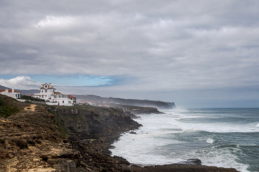 View of Sintra coastline with rough seas on cloduy day