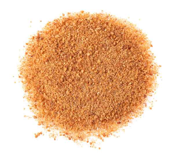 istock Coconut sugar isolated on white background. Brown unrefined coconut palm sugar. Top view. 1350892827