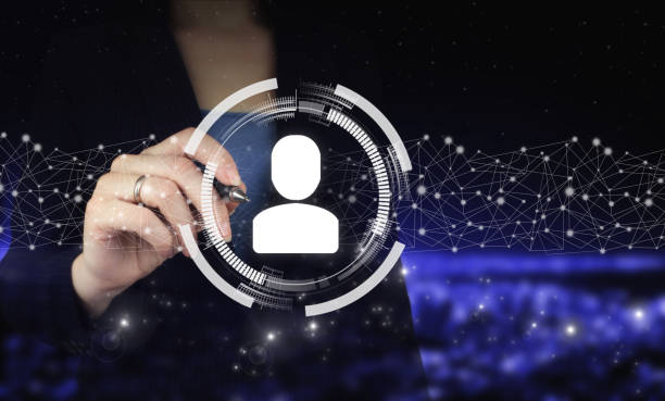 istock Social media concept. Communication network. Hand holding digital graphic pen and drawing digital hologram Human, Leader sign on city dark blurred background. Human search.Leader and CEO. 1350893255