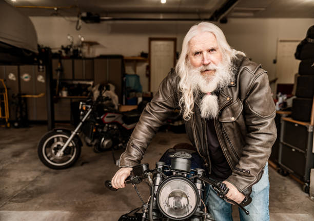 istock Senior man working on his motorcycle 1350894904