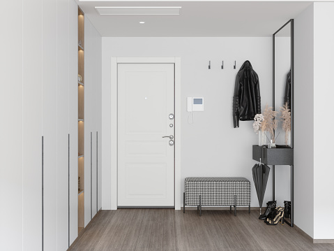 Front Door Entrance To House With Coat Hook,  White Cabinets, Hassock And Mirror In Corridor.