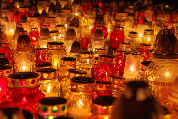 glass candles in the graveyard on All Saints' Day in Poland in November 1 stock photo