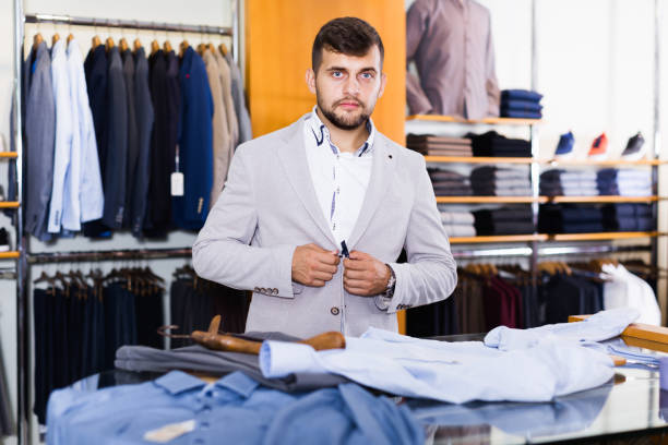 istock Handsome male customer choosing jacket 1350900162