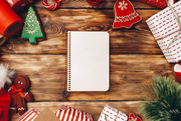 istock Christmas background with presents, coniferous branches and gingerbread cookie 1350900308