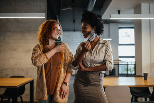 istock Mixed race colleagues at work during pandemic 1350901557