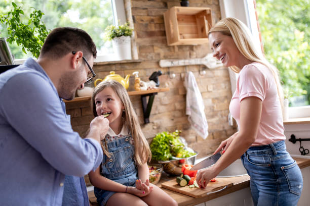 istock Happy family enjoying at home in the kitchen 1350902252