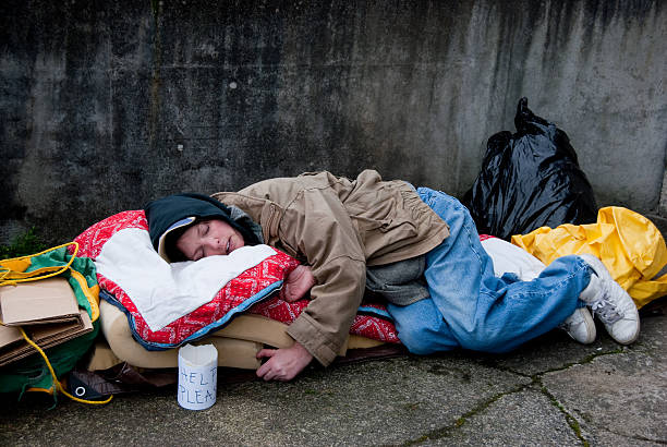 Homeless Beggar Sleeping On Street Under Sketch Of A House