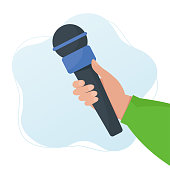 istock Hand holding the microphone. Flat design vector illustration. Live news, journalist, interview concept 1350903564