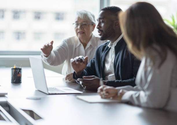 istock Business people engaged in discussion 1350904081