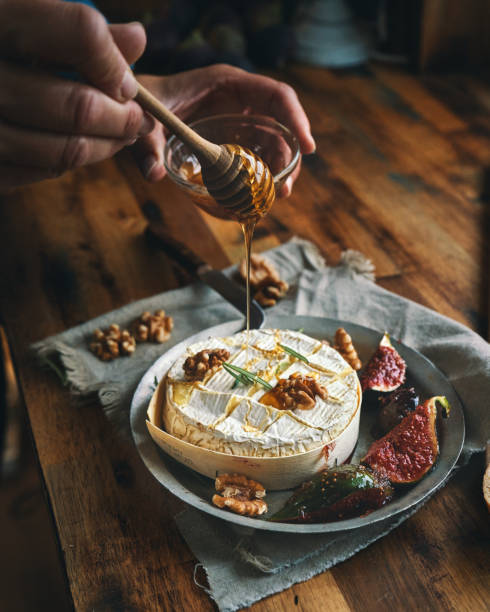 istock Baked Camembert Cheese Served with Honey and Fresh Figs 1350904261