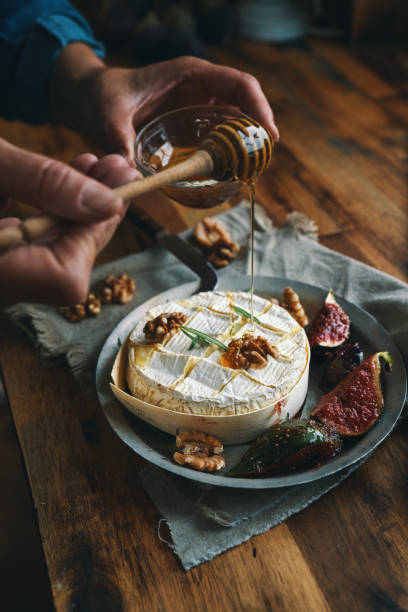 istock Baked Camembert Cheese Served with Honey and Fresh Figs 1350904263