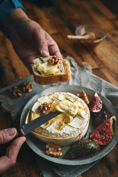 istock Baked Camembert Cheese Served with Honey and Fresh Figs 1350904394