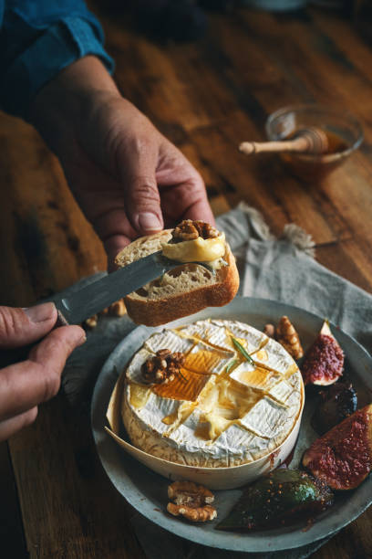 istock Baked Camembert Cheese Served with Honey and Fresh Figs 1350904397