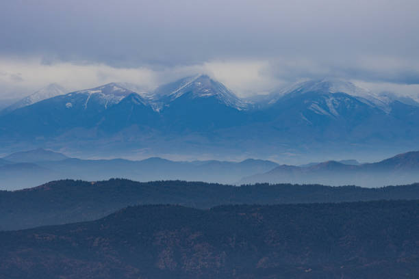 Fog fills the valleys in the foothills of the majestic Sangre de Cristo Mountain Range of Colorado