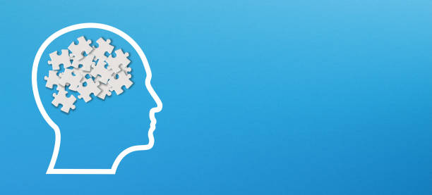 istock Confusion concept, mental health and problems with memory. Human brain shaped made of white jigsaw puzzles inside your head 1350913020