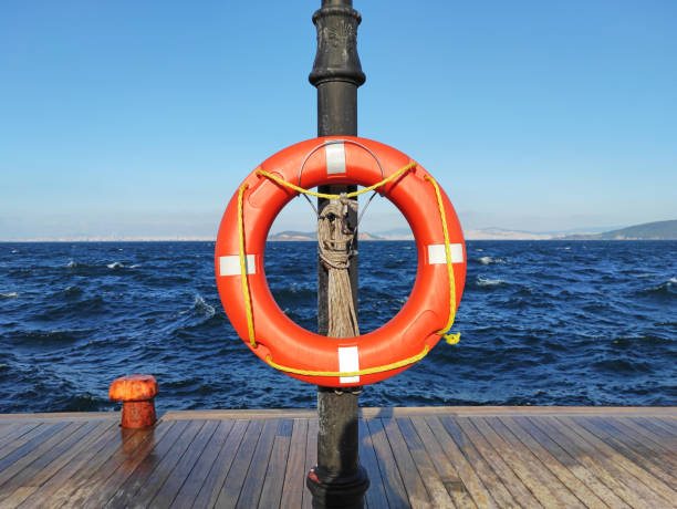 istock Life buoy on pier with clear sky 1350913246