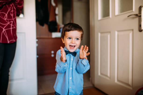 Little boy applauding and smiling