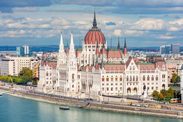 istock Hungarian parliament building and Danube river in Budapest, Hungary 1350917052