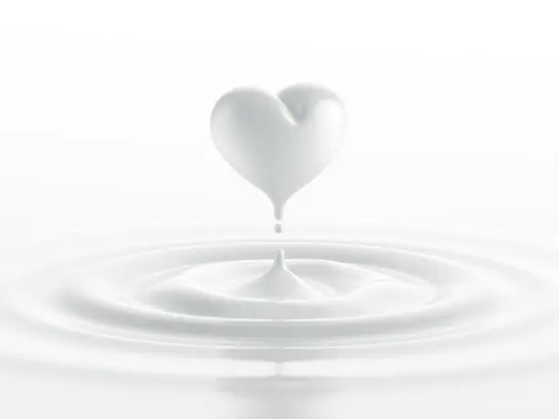 Photo of Drop of milk in form of heart